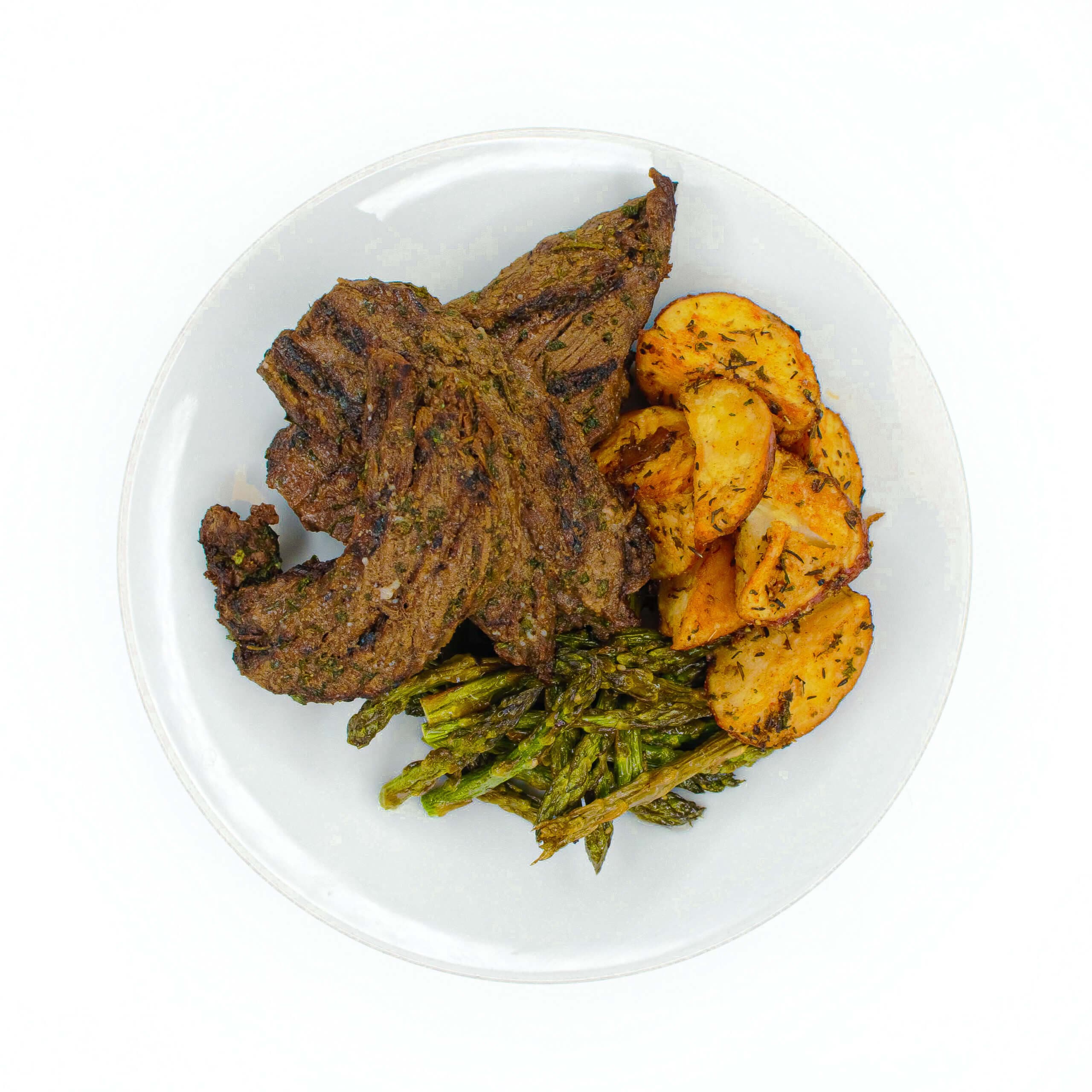 House Marinated Steak Tips with Herbed Potatoes & Asparagus